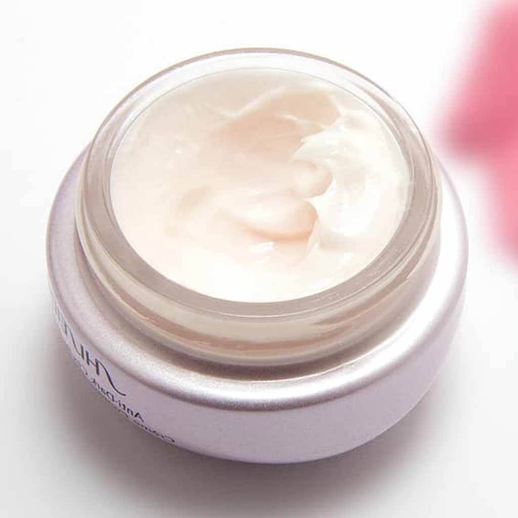 A day cream or night cream jar opened showing richy semi solid moisturizing formula